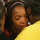 Semehca Nunn, grandmother of the injured 3-month-old boy, is comforted after a prayer service. (Scott Olson/Getty Images)